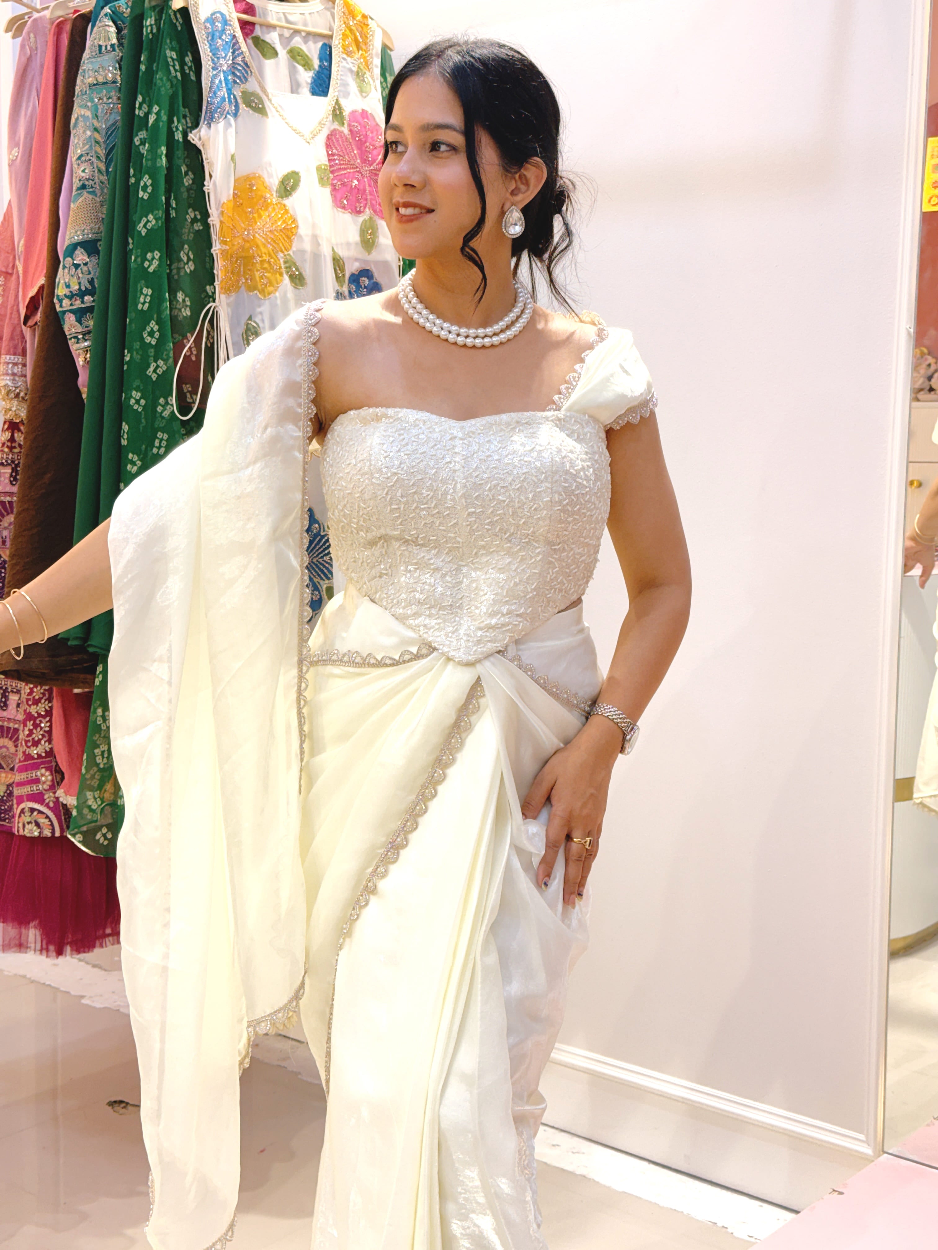 Off white pre drape saree and corset blouse