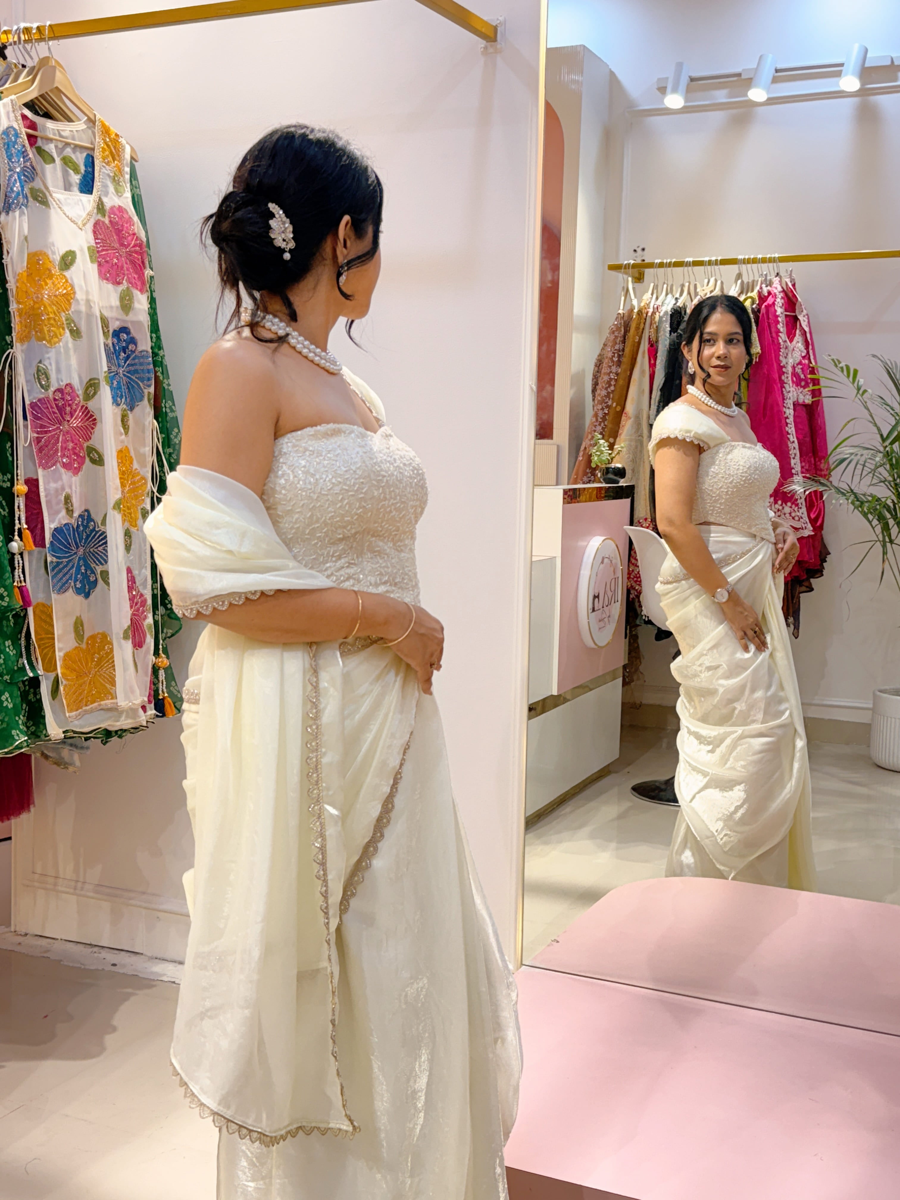 Off white pre drape saree and corset blouse