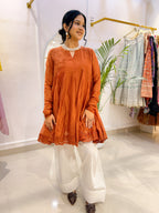 Rust Orange Crinkled Cotton Peplum Kurta Set with White Palazzo